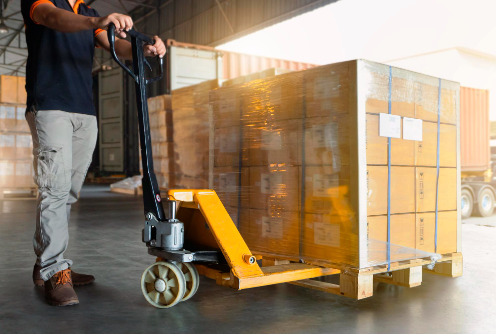 Amazon FBA pallets being unloaded by courier